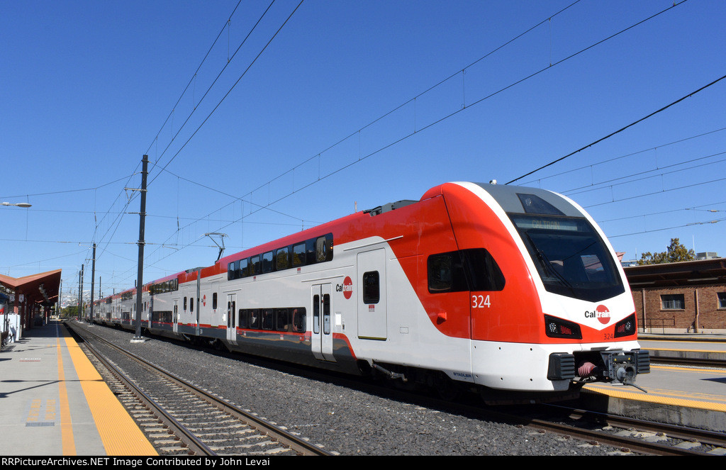 Caltrain Stadler KISS MU # 324 sits on the south end of a consist between assignments at SJC 